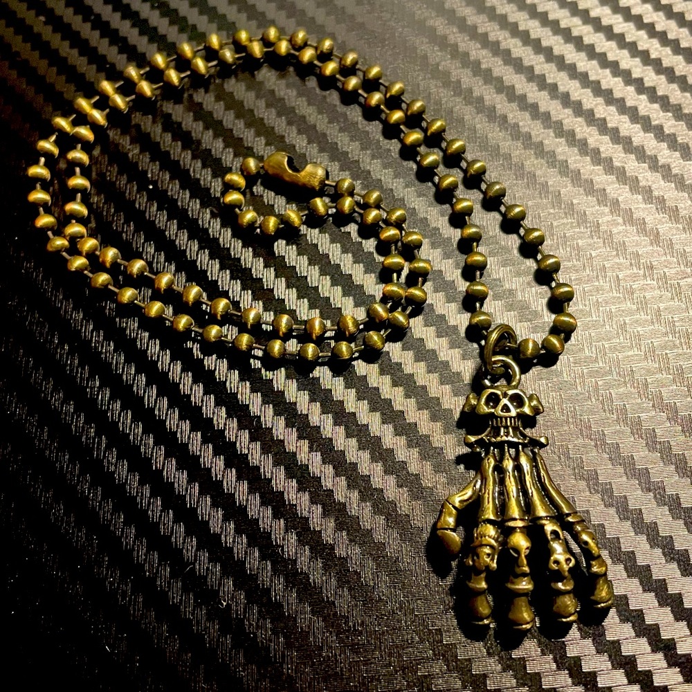 Skeleton hand necklace